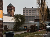 Neusser Hütte, Koppers: Wasserturm und Halle auf dem Areal des früheren Koppers Werks