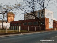 Neusser Hütte, Koppers: Wasserturm und Halle auf dem Areal des früheren Koppers Werks